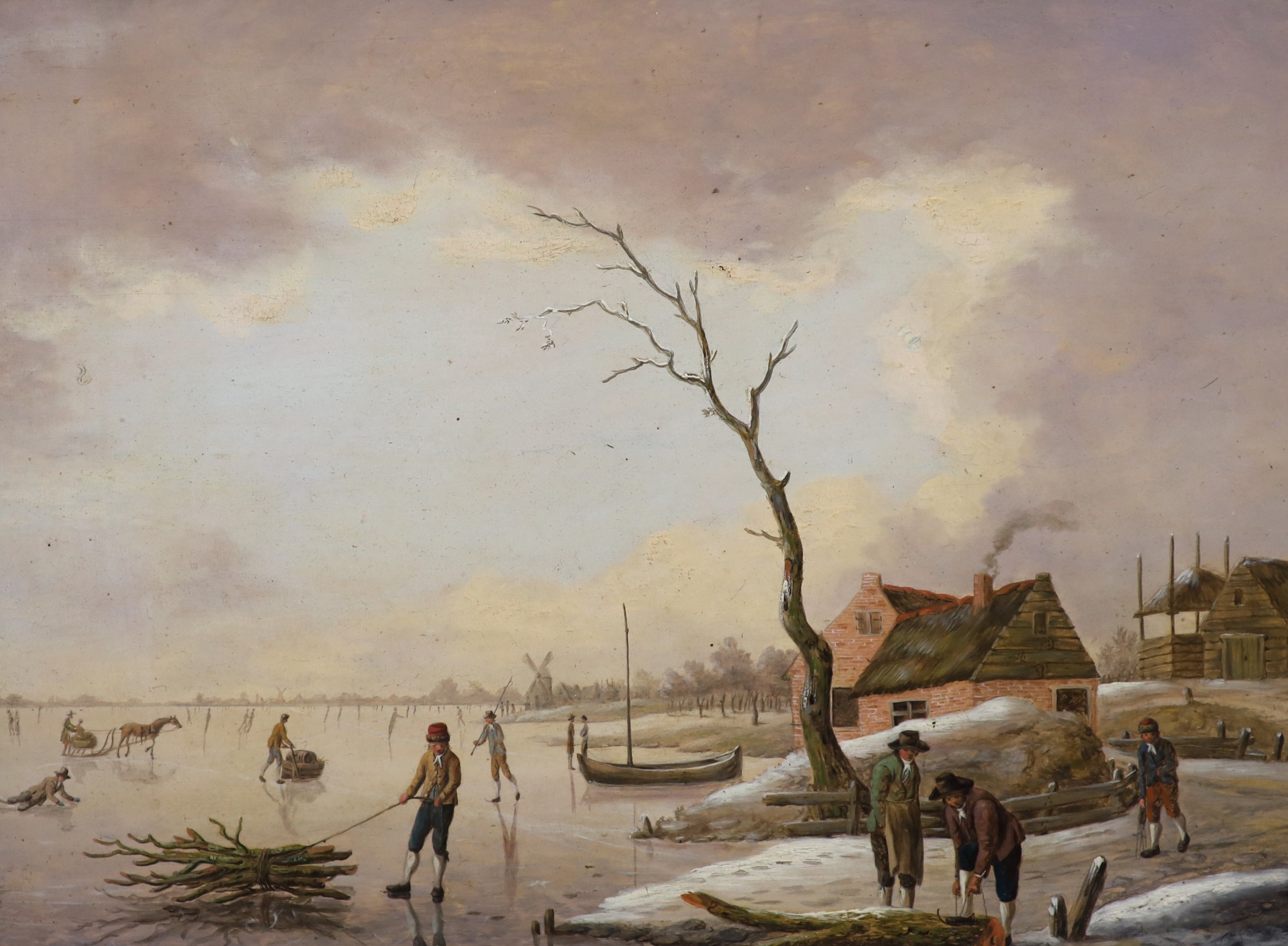 Attributed to Hendrik Willem Schweickhardt (German, 1746-1797), Winter landscape with skaters on the ice, oil on wooden panel, 23 x 31cm